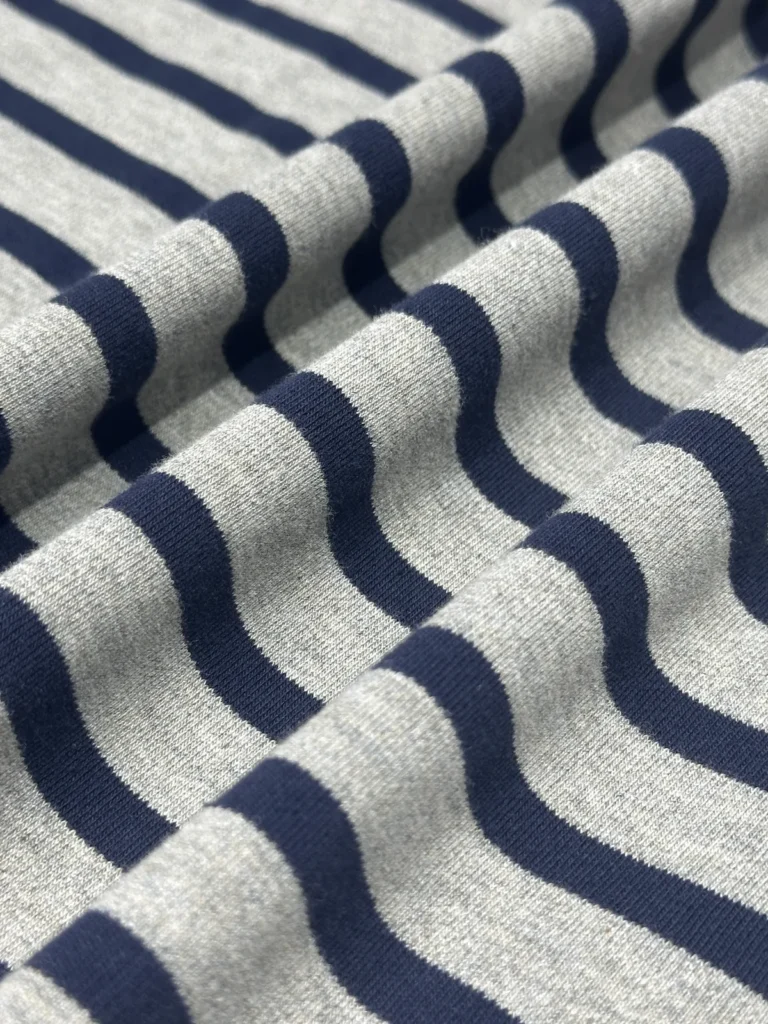 Oatmeal grey and navy stripe jersey fabric