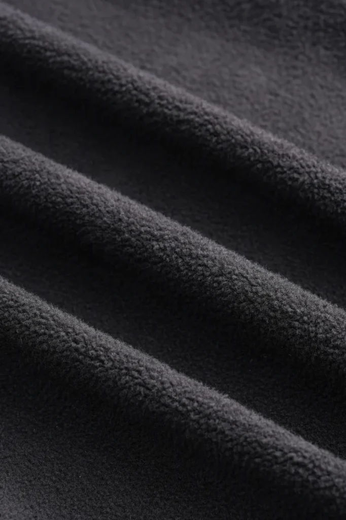 Black structured knit fabric close-up