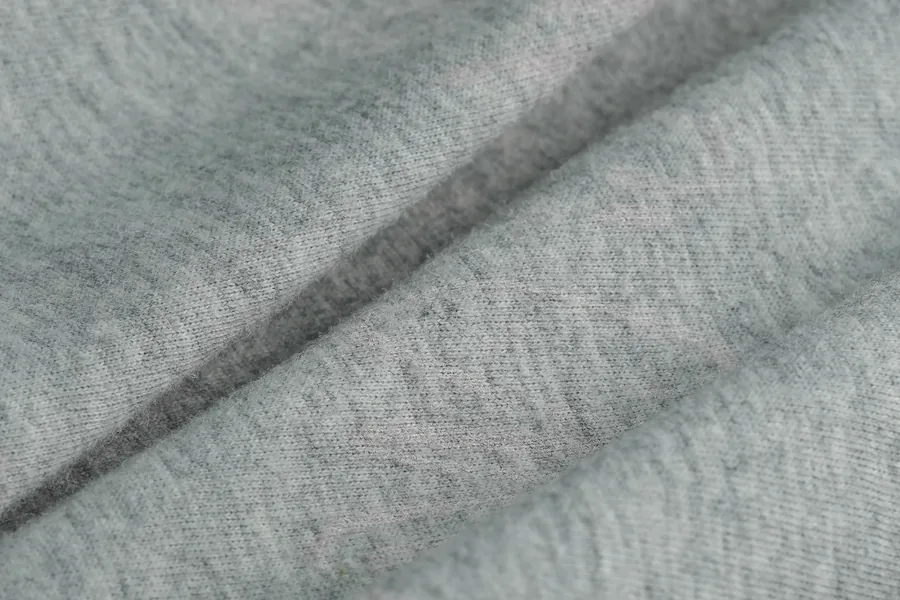 Grey knitted fabric texture close-up for sample development